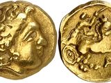 a gold coin with an image of a man riding a horse