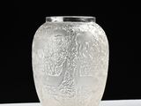 a glass vase that is sitting on a table