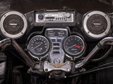 a close up of a motorcycle dashboard with various gauges
