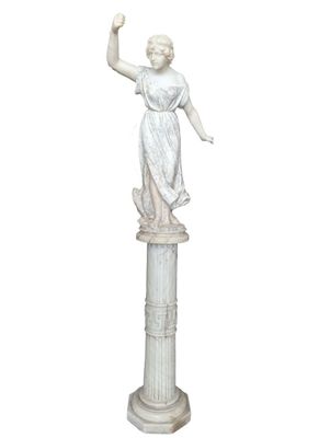 marble statue of a woman holding a bird on a pedestal