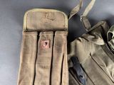 a bag and a backpack on a table next to each other