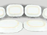 six pieces of white and gold dinner plates with gold rims