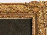a picture of a gold framed mirror on a white wall