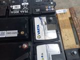many different types of batteries sitting on a pallet