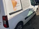 a white van that is parked in a parking lot