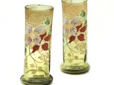 two vases that have been decorated with flowers on them