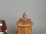 two vases sitting next to each other on a table