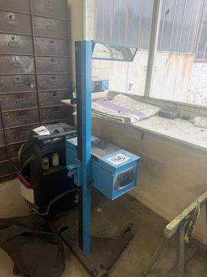 a blue machine that is sitting in the corner of a room