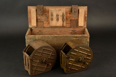 an old wooden box with two open doors on a black background