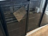 two glass doors that are open on the side of a building