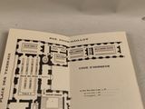 an open book with a drawing of a floor plan on it