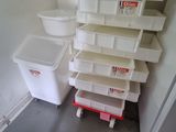 a stack of bins in the corner of a room