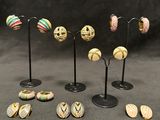 a set of five small figurines of different shapes and sizes