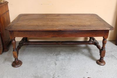a wooden table that is sitting in a room