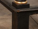 a black and gold bed with a wooden headboard