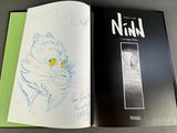 a book with a drawing of a cat on it
