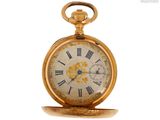 une montre de poche en or avec des chiffres romains