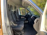 the interior of a van with the doors open and the seats down