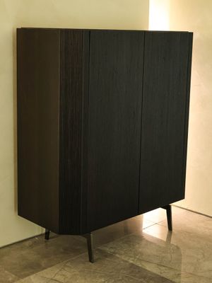 an image of a black cabinet in a living room