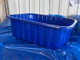a blue plastic container sitting on a blue plastic bag