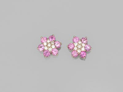 a pair of pink sapphire and diamond earrings