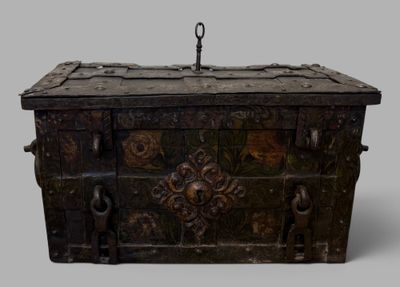 a wooden chest with a metal handle on a gray background
