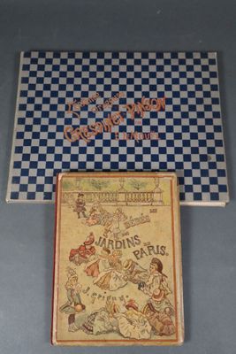 un vieux livre avec une couverture à carreaux et l'image d'un homme à cheval