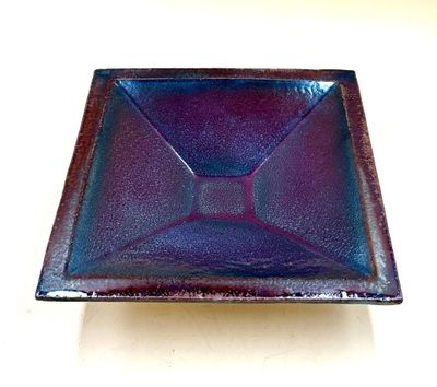 purple and blue glass square dish on a white surface