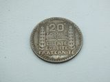 a close up of a coin on a table with a white background