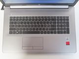 a laptop computer sitting on top of a white table