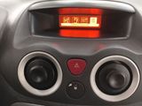 a close up of a car ' s dashboard with a red light