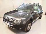 a picture of a grey dacia parked in a garage