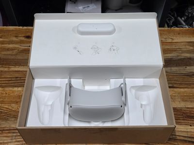 a white box with a cup and a cup holder inside of it