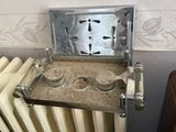 a picture of an old stove with a metal plate on it
