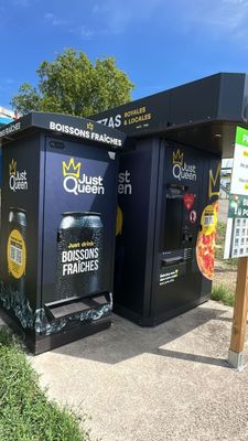 two vending machines that are on the side of the road