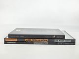 three books stacked on top of each other on a white surface