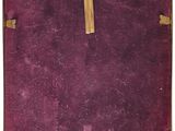 purple velvet covered picture frame with gold trim and a cross on the front
