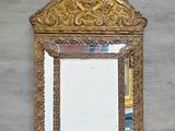 a mirror hanging on the wall above a sink