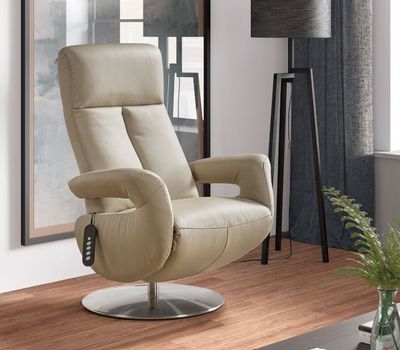 the recliner chair is sitting in the corner of the living room