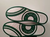 the soles of a pair of tennis shoes on top of a box
