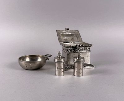 a silver kitchen set with a stove and a bowl