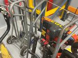 many tools that are sitting on a cart in the garage