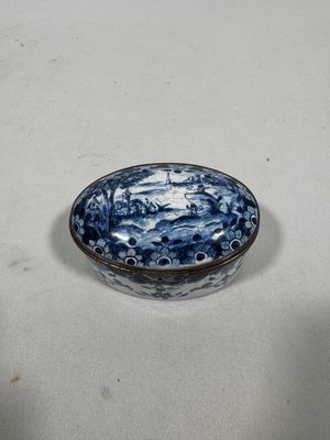 a blue and white bowl sitting on a table