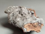 close up of a piece of rock with a lot of crystals on top of it