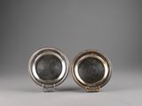 a pair of silver plated dishes on stands