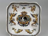 a plate with a picture of a man and a woman on it