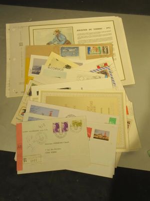 a pile of mail sitting on top of a table