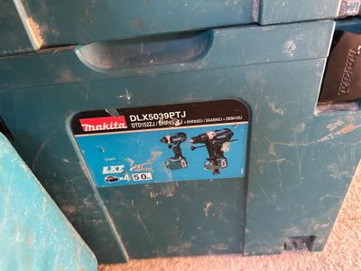 a blue tool box with two tools in it