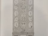 an old book with a drawing of a tall cabinet on top of a table