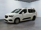 the white van is parked in a large white room